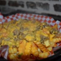 Boudin Cheese Fries · Creole seasoned fries toped with spicy cheese toped with boudin!