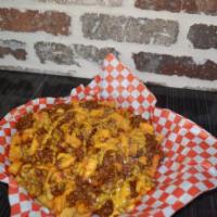 Chili Cheese Fries · Creole seasoned fires topped with our spicy cheese and homemade chili!