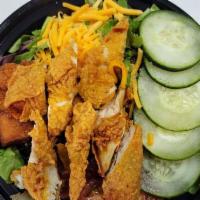 Crispy Creole Fried Chicken Strips Salad · Fresh mixed greens, tomato, cucumbers, croutons, and fried chicken breast!
