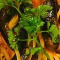 Linguini Seafood · Clams mussels calamari shrimp marinara sauce.