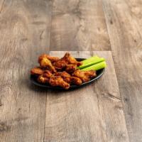 8 Piece Chicken Wings · Cooked wing of a chicken coated in sauce or seasoning.