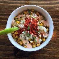 Elotes · Mexican corn in a cup. Served with chili, mayonnaise, cotija cheese, and butter.
