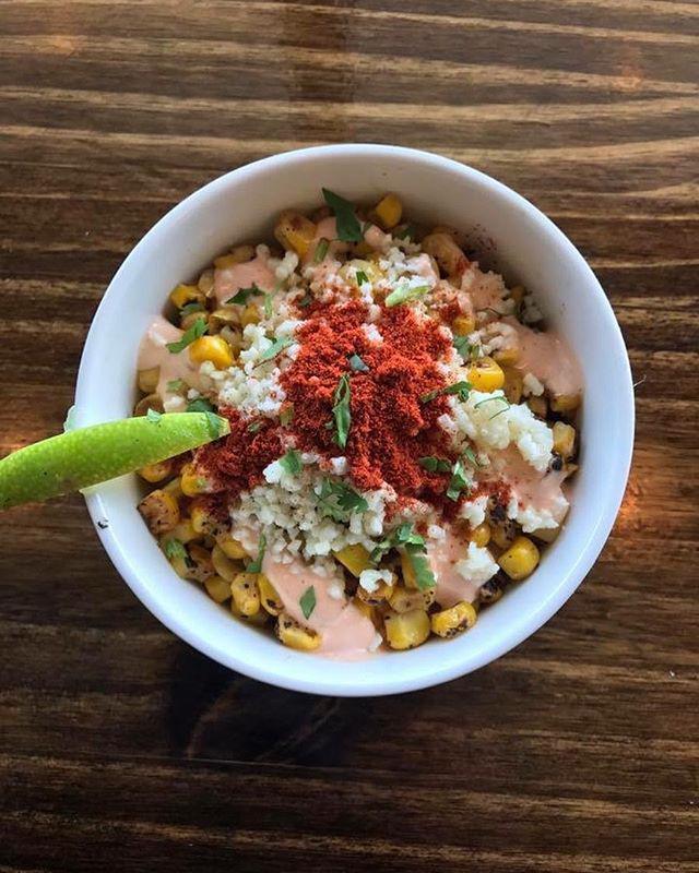 Elotes · Mexican corn in a cup. Served with chili, mayonnaise, cotija cheese, and butter.