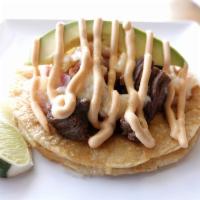 Signature taco · bacon, pineapple, onion, steak, Mexican blend cheese, avocado, chipotle mayonnaise.
