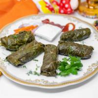 Dolmades Armenia · Flavorful ground turkey and rice rolled in grape leaves, with house-made yogurt-cucumber sau...