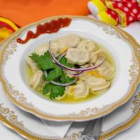Pelmeny Siberian · Our Slavic chicken-stuffed dumplings, somewhat similar to ravioli or wontons, are topped wit...