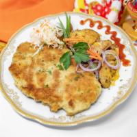 Schnitzel Europa · Juicy seasoned chicken breast cutlet, lightly breaded, pan fried and served with roasted pot...