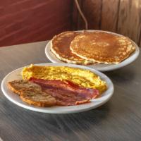 #16. Two Pancakes 2 Eggs with Turkey Bacon and Turkey Sausage · Flat sweet cake. Cured turkey.