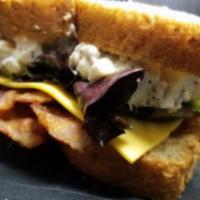 L. DiCaprio on Wheat Bread · Chicken salad, bacon, American cheese, spring mix, Roma tomatoes, mayonnaise, and our famous...
