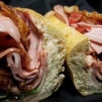 A. Pacino on Crusty Italian Bread · Mortadella, bacon, provolone cheese, spring lettuce, Roma tomatoes, mayonnaise, and our famo...