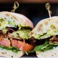 Posh B.L.T.A Sandwich · Applewood bacon, rocket, tomato, avocado, shaved cucumber, and garlic aioli on ciabatta.