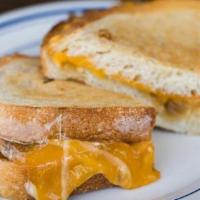 Kids Cheese Toasty  · Gouda cheese, sharp cheddar cheese, sourdough, and french fries.