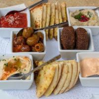 Baboush Mezza Platter Dinner · All of our spreads & olives, served with harissa lebna & pita bread.