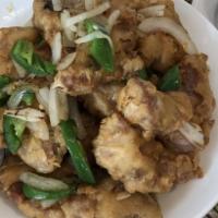 78. Salt and Pepper Pork chops · Deep fried pork chops topped with minced onions and jalapenos.