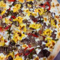 Philly Cheesesteak Pie · Made with Provolone cheese, Fresh Mozzarella cheese, American cheese, Steak, green peppers, ...