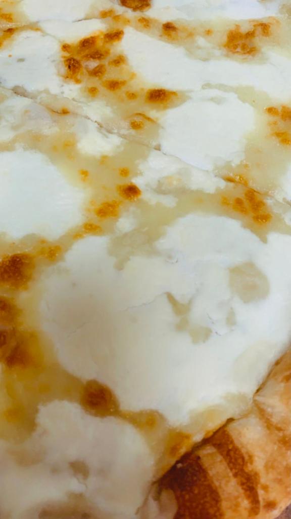 White Pizza · Ricotta, mozzarella and grated pecorino Romano cheese. Add toppings for an additional charge.
