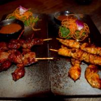 Chicken Satay · Skewered meat with satay peanut sauce.