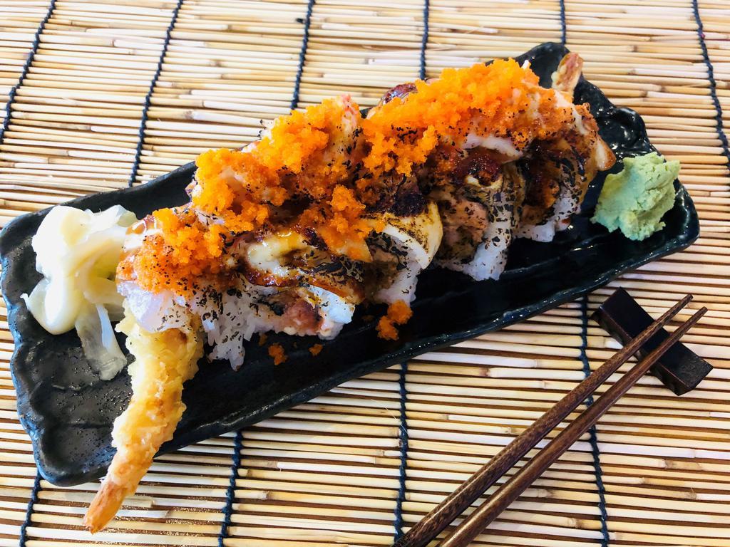 Sakura Roll · Deep-fried shrimp and spicy tuna inside, topped with tuna, albacore, crab mix and masago. Torched. Spicy. 