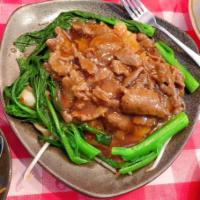 S4. Beef and Vegetables Chow Fun · Served with brown gravy sauce.