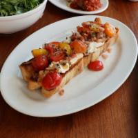 Bruschetta · Toasted focaccia bread topped with seasoned ricotta cheese and marinated cherry tomatoes.
