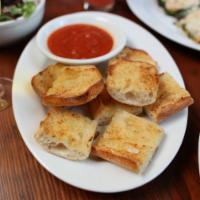 Garlic Bread · A great way to start your meal! Delicious garlic bread served with a side of tomato sauce fo...