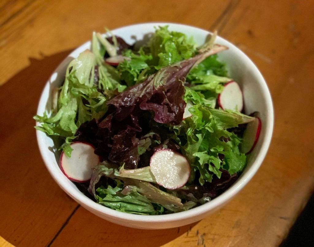 Simple Salad · Mixed greens with shaved radish, chives, and red wine vinaigrette. Vegan and gluten free.
