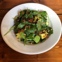 Baby Kale Salad · Baby kale tossed in tahini dressing, topped with fresh avocado, crisped sweet potato, and su...
