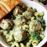 Cavatappi Chicken Pesto · Mini chicken meatballs with broccoli and pesto over corkscrew pasta.