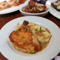 Roasted Chicken · Oven roasted chicken breast over mashed potatoes served with crispy cauliflower