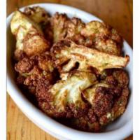 C'alliflower · Cauliflower flash fried and tossed in Caesar dressing to give it a nice flavored crust. Glut...