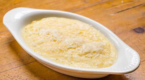 Freshly-Milled Polenta · From Wild Hive Farm, creamy corn polenta finished with parmesan cheese.