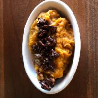 Smashed Sweet Potato · Smashed sweet potatoes topped with a fall spiced butter and candied pecans. Gluten-free.