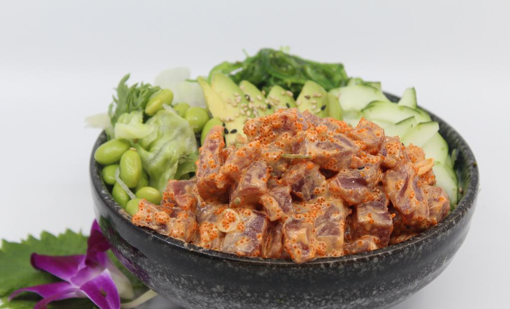 Spicy Ahi Tuna Poké Bowl · Choice of protein with rice base, pickled cucumber, avocado, edamame, green leaf lettuce and seaweed salad. Contains raw fish.