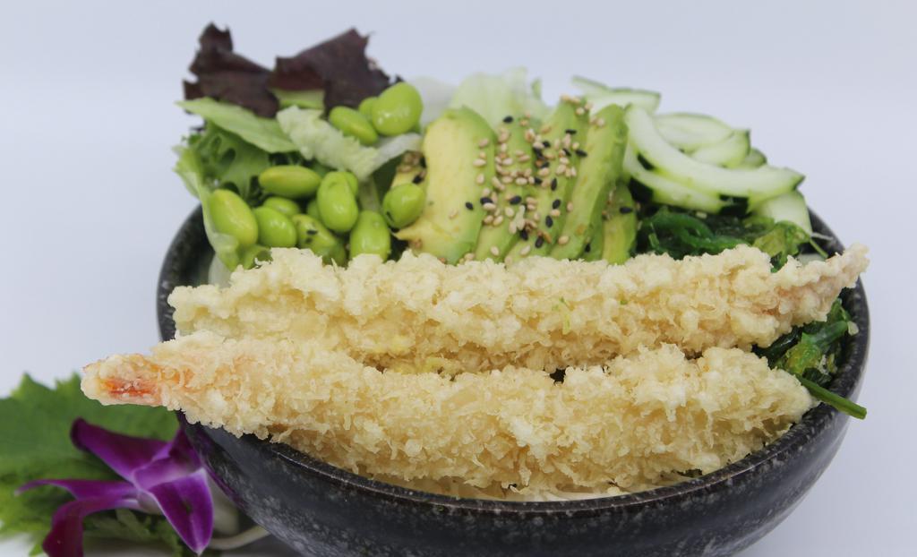 Shrimp Tempura Poké Bowl · Choice of protein with rice base, pickled cucumber, avocado, edamame, green leaf lettuce and seaweed salad.