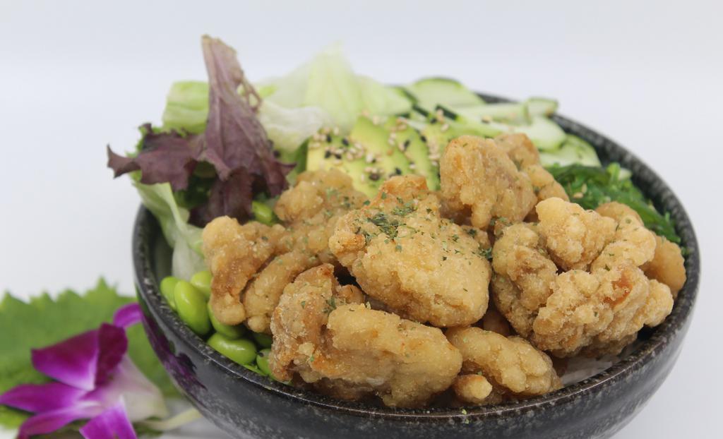 Chicken Karaage Poké Bowl · Choice of protein with rice base, pickled cucumber, avocado, edamame, green leaf lettuce and seaweed salad.