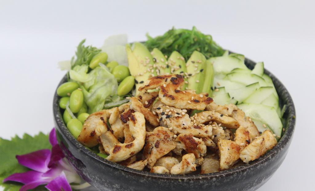 Hawaiian Grilled Chicken Poké Bowl · Choice of protein with rice base, pickled cucumber, avocado, edamame, green leaf lettuce and seaweed salad.