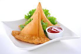 2 Pieces Vegetable Samosa · Crisp turnovers stuffed with mildly spiced potatoes and peas.