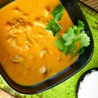 Chicken Coconut Korma · Boneless chicken cooked with coconut milk and curry spices. Served with rice.