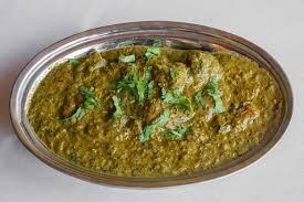 Lamb Saag · Boneless lamb cooked with spinach, onions, garlic, ginger, cream and spices. Served with rice.