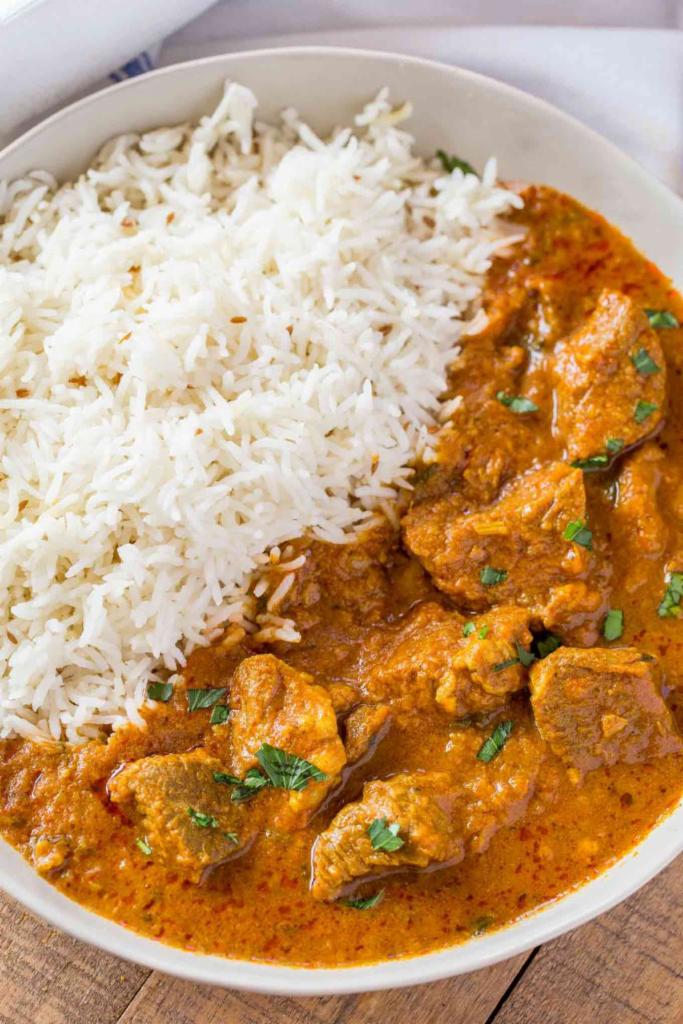 Lamb Curry · Boneless lamb cooked in a sauce made of onions, garlic, ginger and curry spices. Gluten Free. Served with rice.