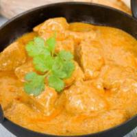 Lamb Korma · Boneless lamb cooked with onions, cashews, golden raisins, cream and mild spices. Served wit...
