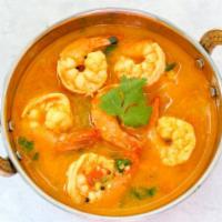 Shrimp Coconut Korma · Shrimp cooked with coconut milk, onions, tomatoes and spices. Served with rice.