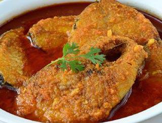Fish Curry · Boneless pieces of salmon cooked in a sauce made of onions, garlic, ginger and spices. Gluten Free. Served with rice.