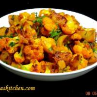 Aloo Gobhi · Cauliflower and potatoes cooked with onions, tomatoes and spices. Served with rice. Vegetari...