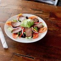 BBQ Tri-Tip Salad · Fresh mixed greens, red onion, tomato, cucumber, avocado, red and yellow peppers topped with...