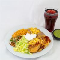 9. Chiles Rellenos Combination Plate · Two chile rellenos smothered with red enchilada sauce and cheese served with guacamole, sour...