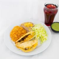 11. Two Tacos Combination Plate · Your choice beef or chicken or fish. Beef-corn hard shell tacos with cheese and lettuce on t...