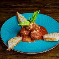 Polpette al Ragu · Meatballs in tomato sauce and Parmigiano-Reggiano.