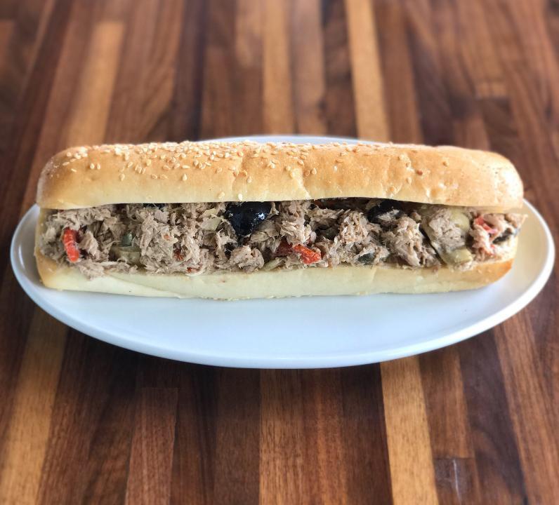 Mediterranean Tuna · Our special tuna salad made with marinated artichokes, olives, sun-dried tomatoes & capers