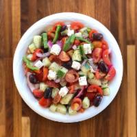 Village Salad · Tomatoes, cucumbers, bell peppers, Kalamata olives, feta cheese, red onions, oregano and tos...